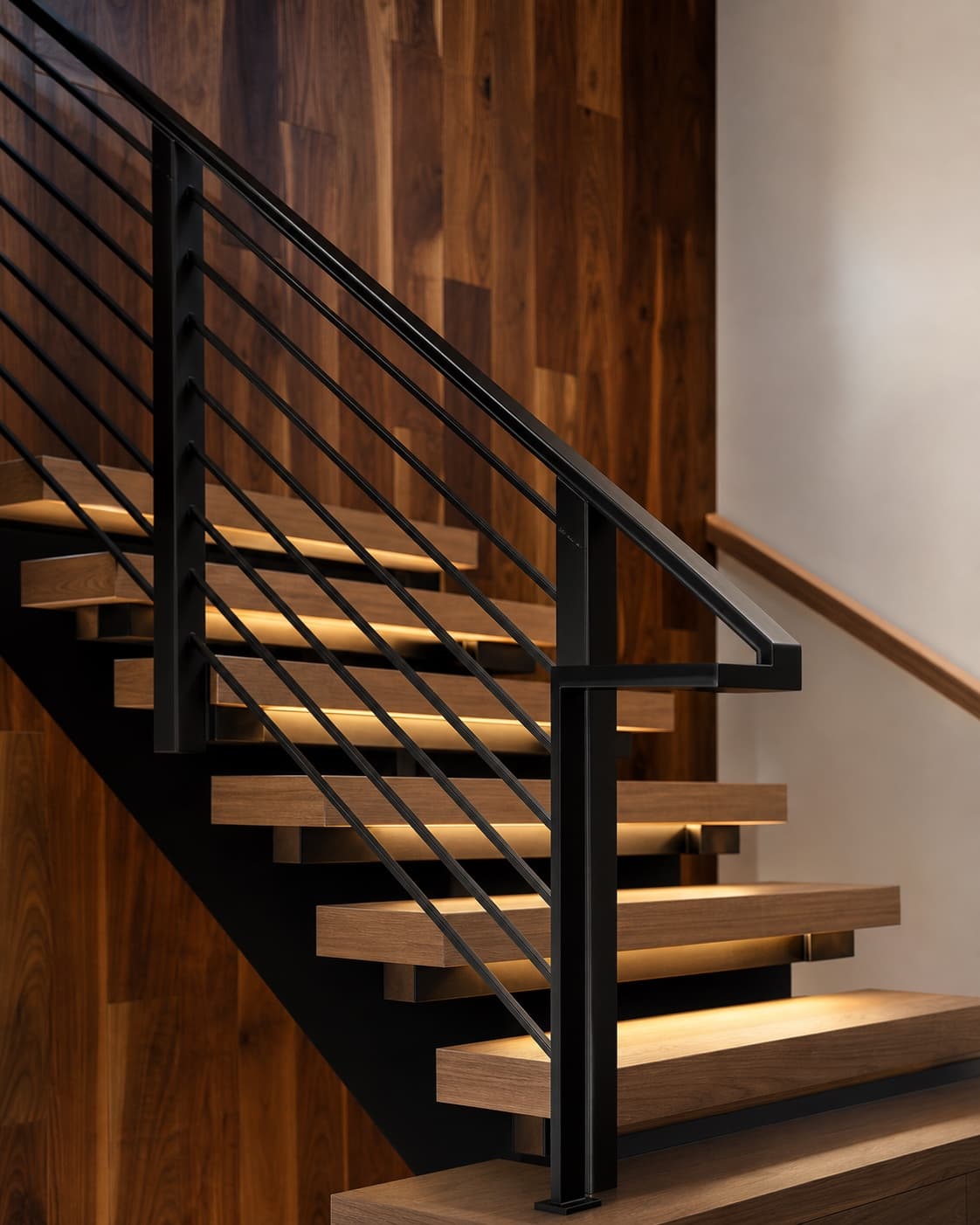 Detailed view of a custom black steel railing in a private residence.